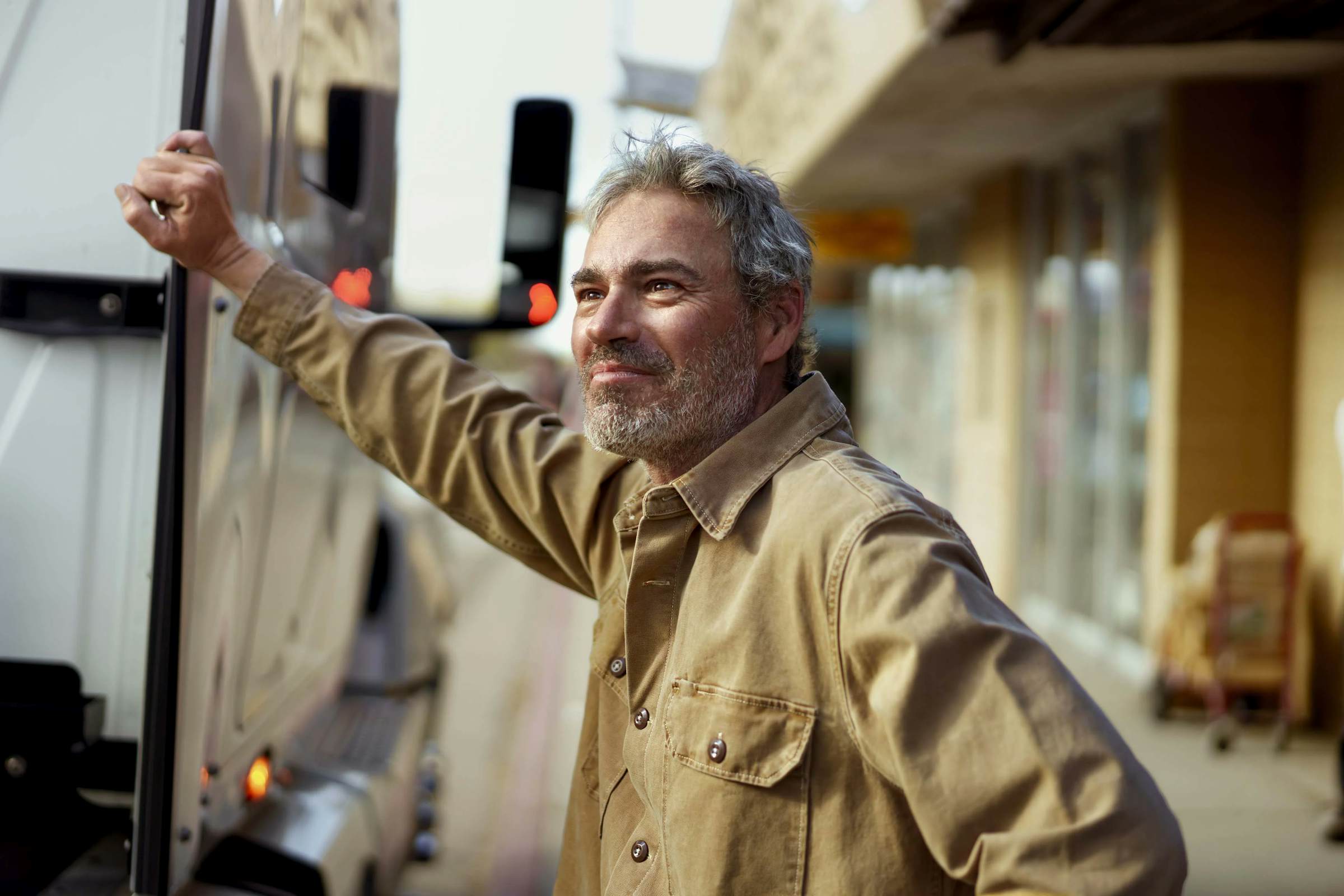 A person touching a truck