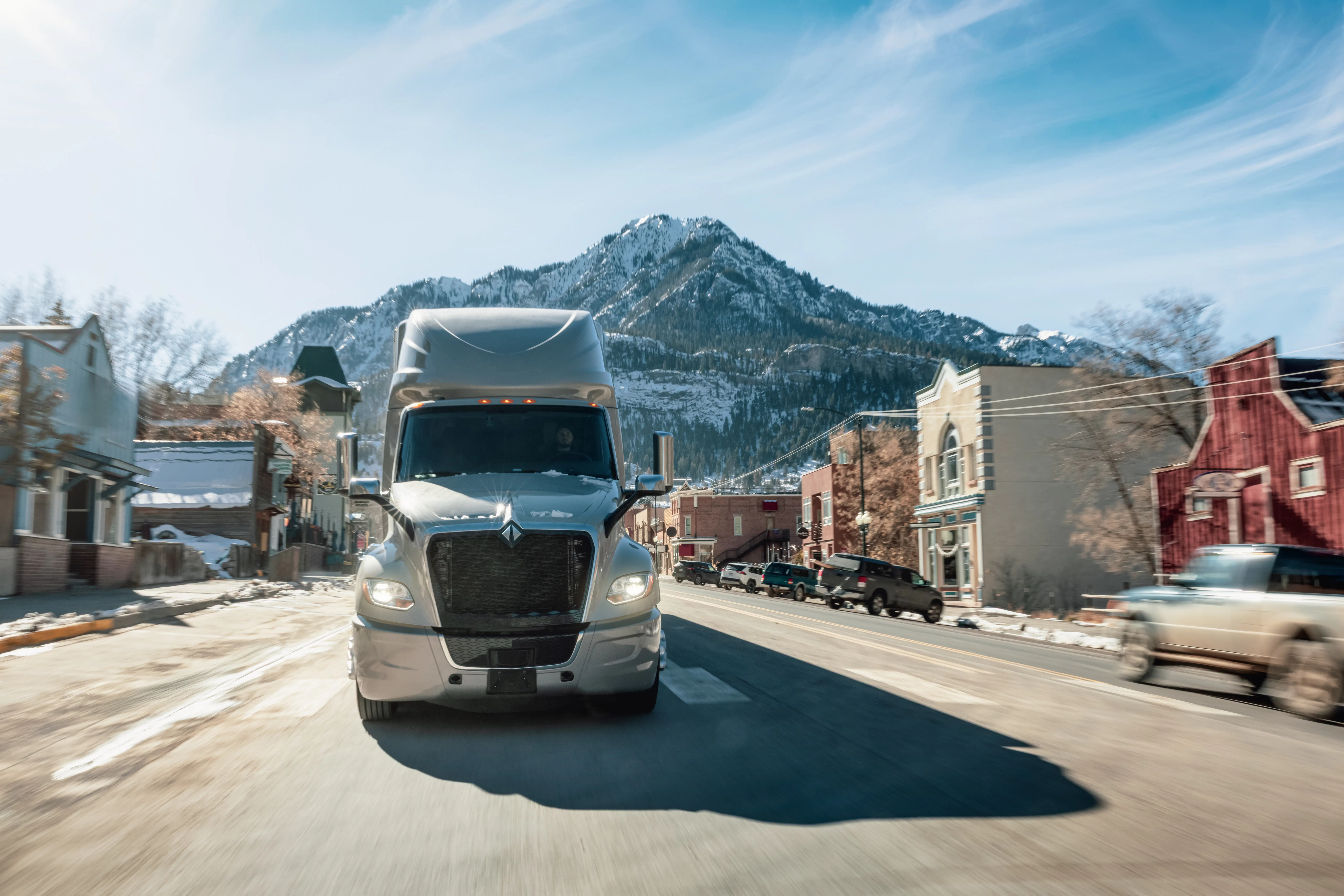 A truck with mountains in the background