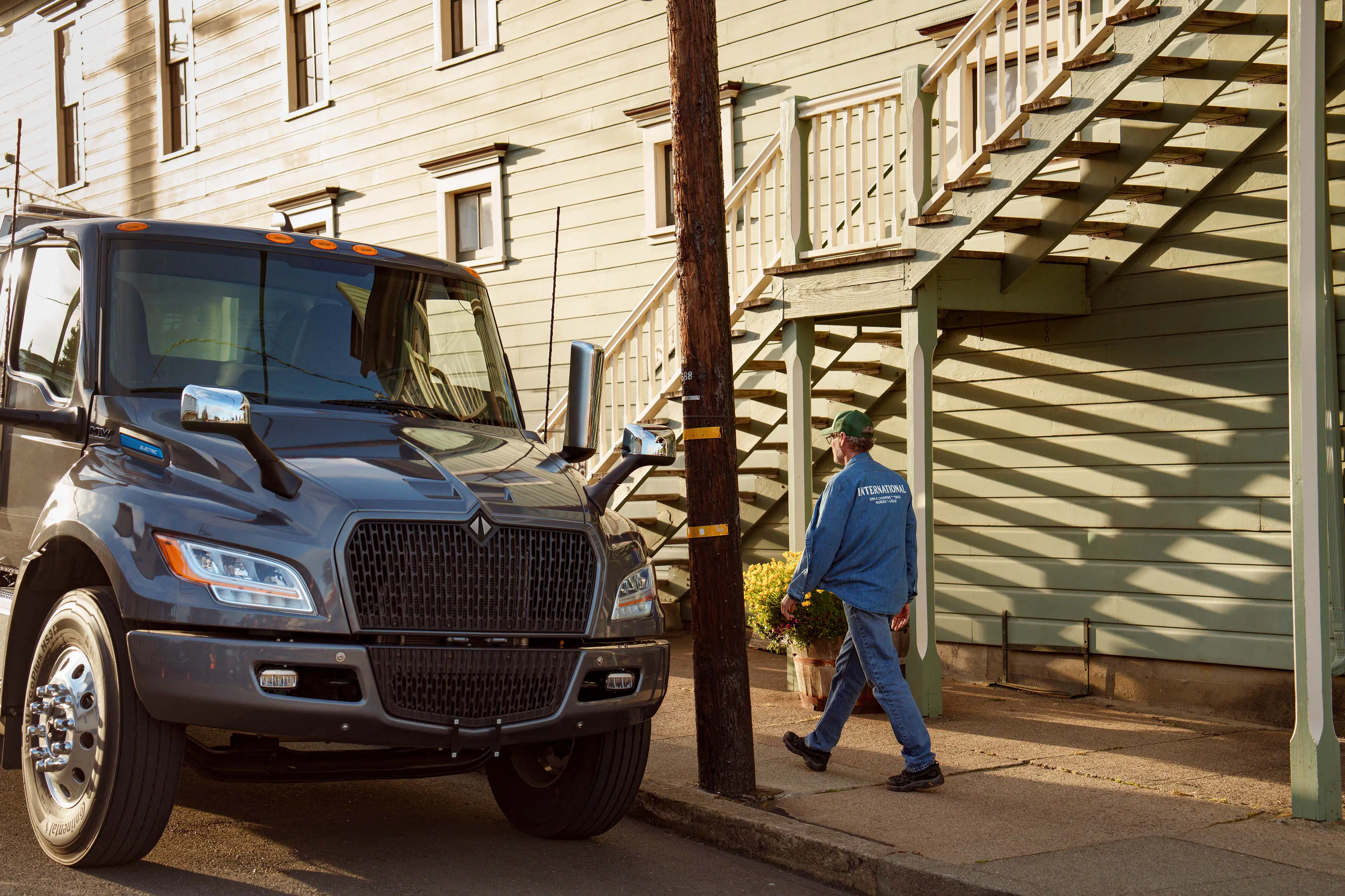 International eMV Foreground Parked male Driver Walking Town Tomales