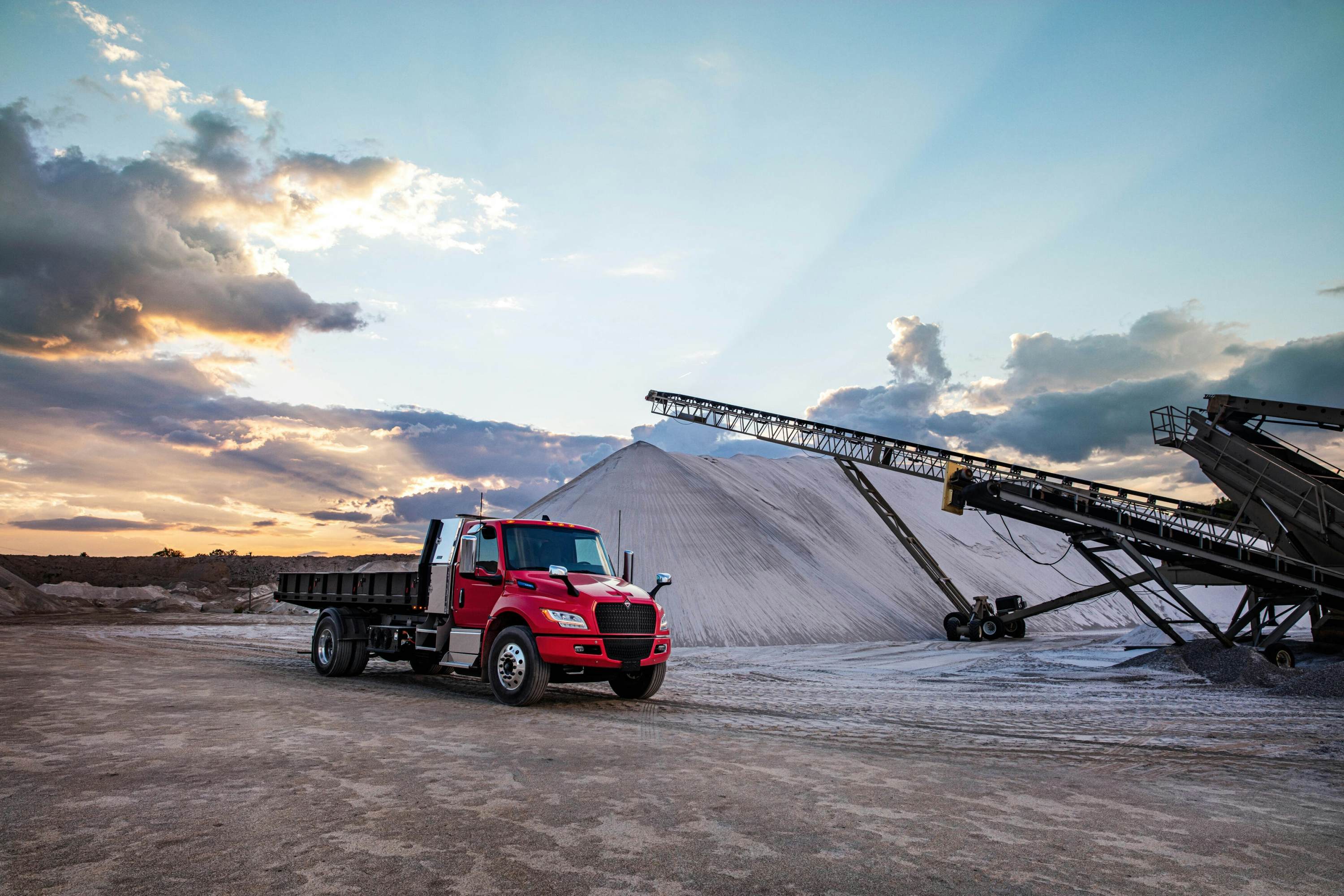 A truck in a dirt field
