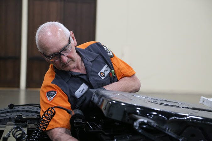 A person in an orange and black uniform