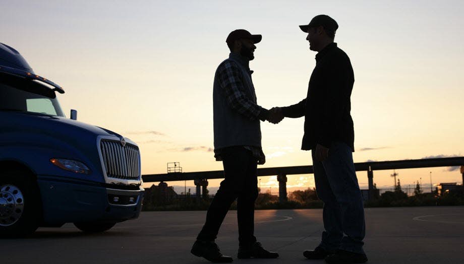 A couple of men shaking hands