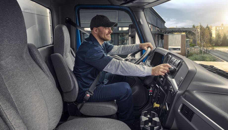 A person driving a truck