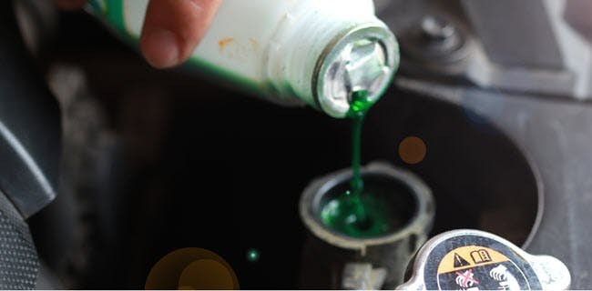 A close-up of a paint can pouring out of a container