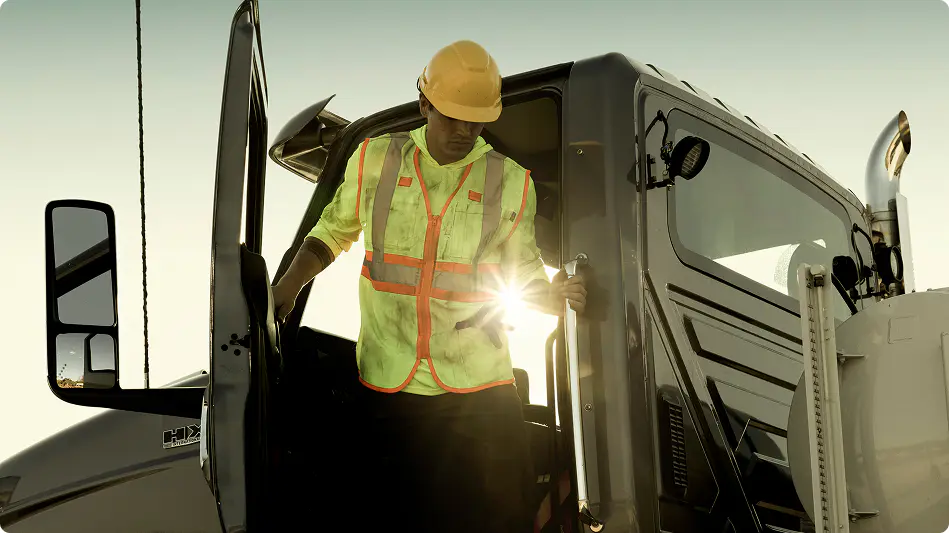 A worker getting out of a truck