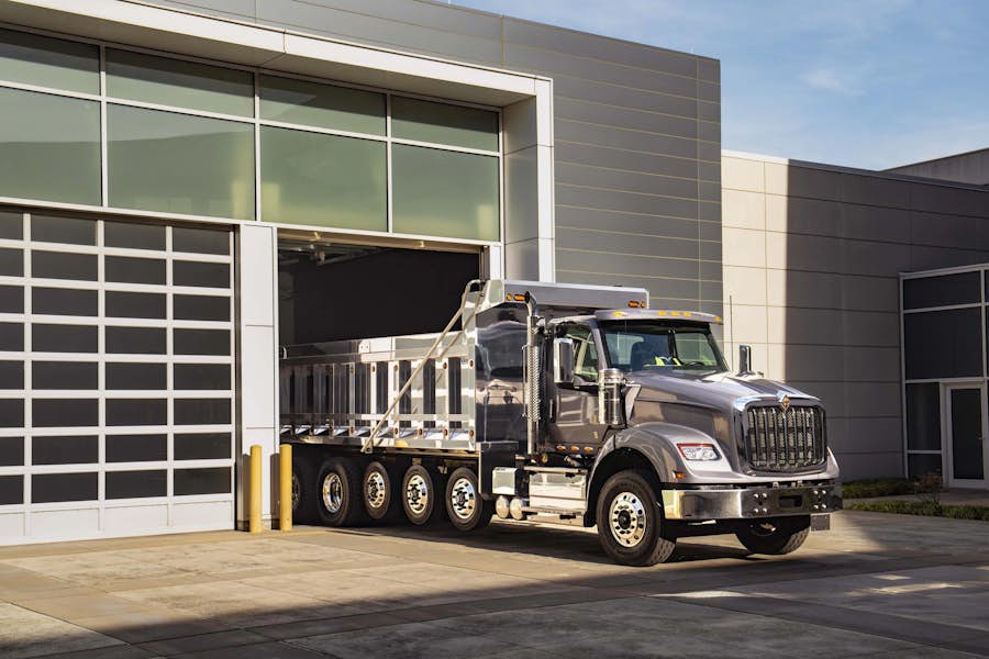 A truck parked in front of a building