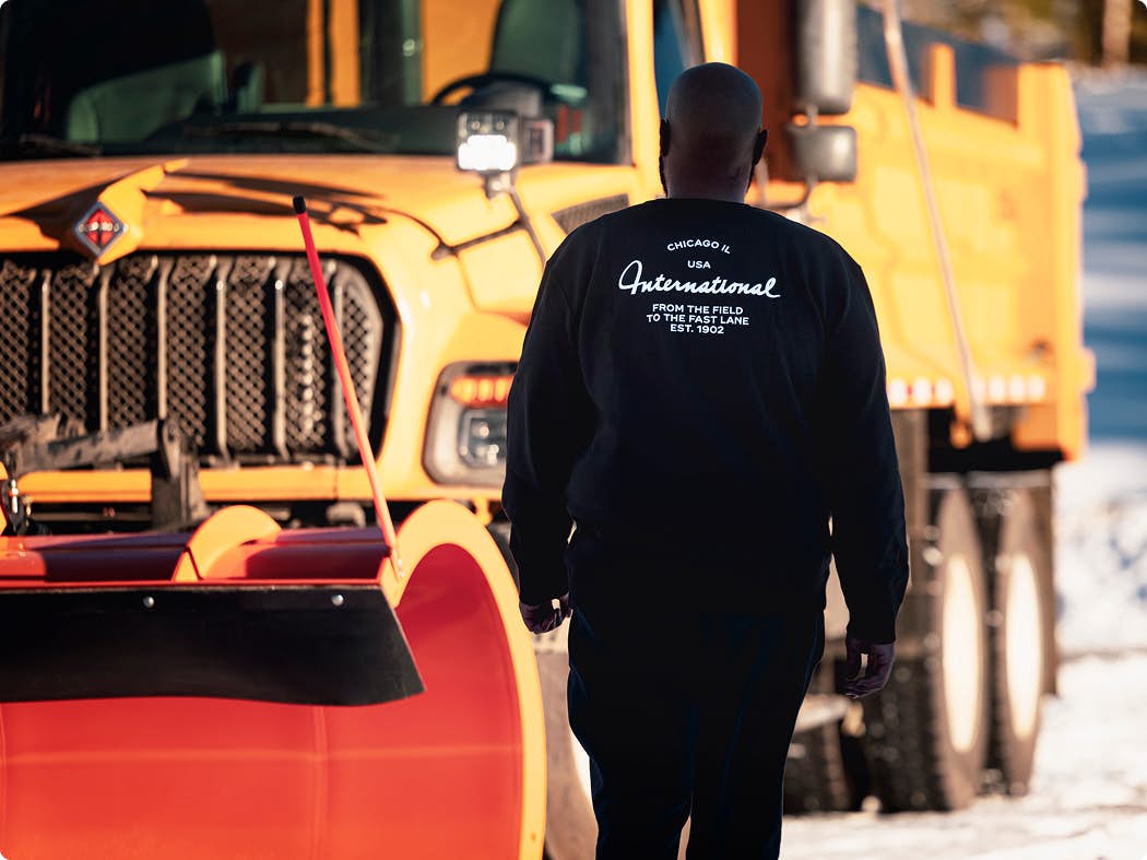 A person walking near a truck